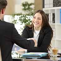 Businesspeople handshaking after negotiation